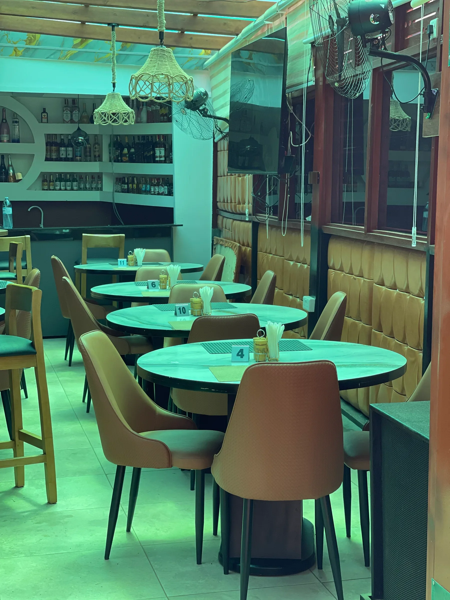 The restaurant dining area with its gold upholstered seating