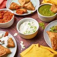 Samosas served with chutneys