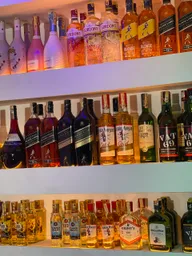Spirits on the back-lit bar shelves